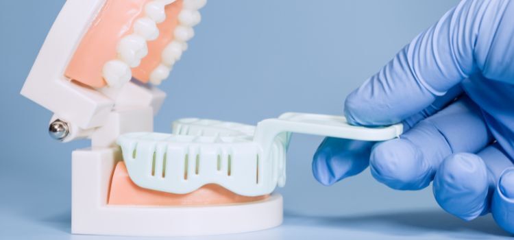 Dental Impression Tray on Model with Gloved Hand