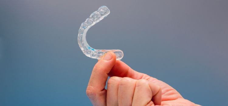 Holding a custom-fit dental night guard